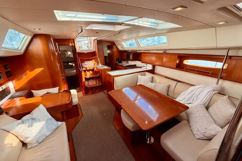 Slide: The Image of Luxurious interior of 2007 Beneteau 49 yacht with elegant wood finish and plush seating. - 92