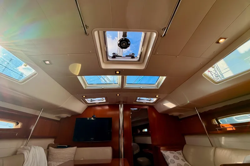 Slide: The Image of Interior of 2007 Beneteau 49 yacht with skylights and modern furnishings. - 94