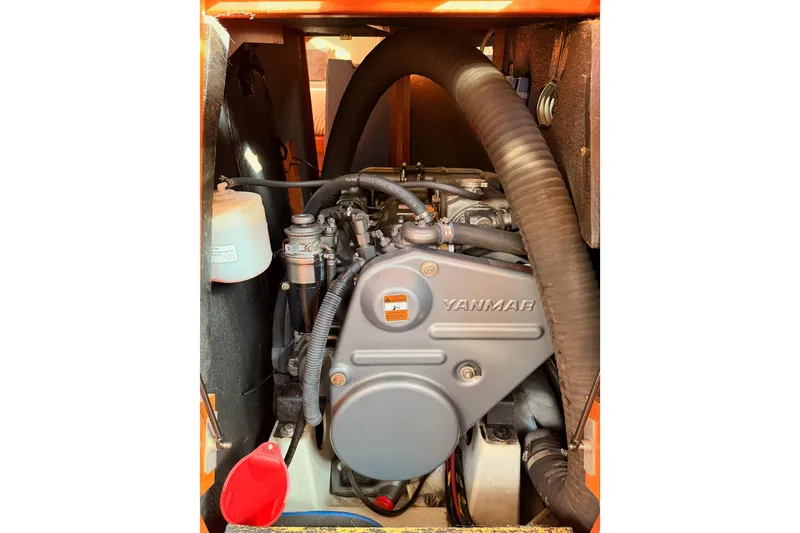 Slide: The Image of Yanmar engine in a 2007 Beneteau 49 sailboat, showcasing detailed components. - 95