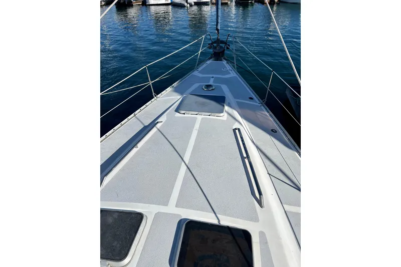 Slide: The Image of 1986 Hunter Legend 45 sailboat deck with railing, docked in marina. - 11