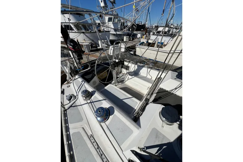 Slide: The Image of 1986 Hunter Legend 45 sailboat cockpit with winches and rigging at marina. - 14