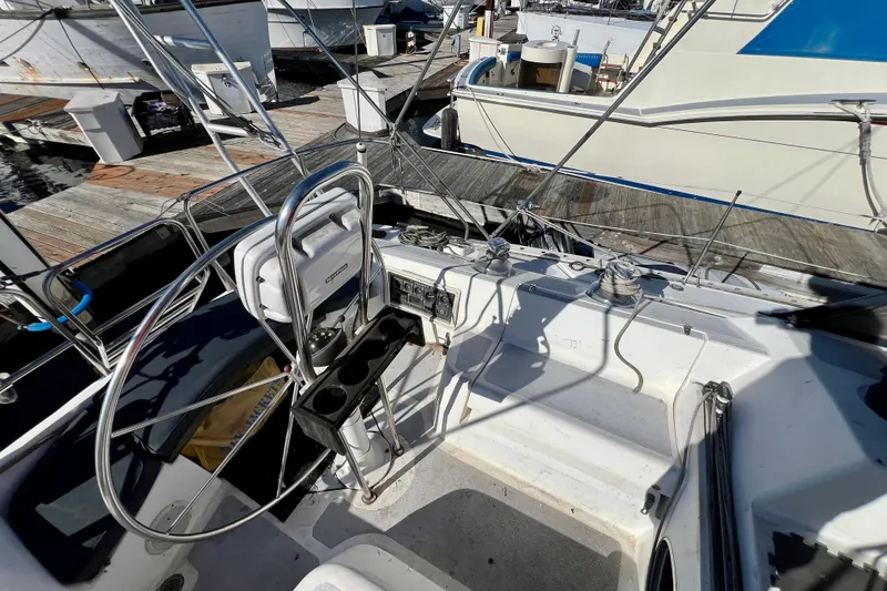 Slide: The Image of Cockpit of 1986 Hunter Legend 45 sailboat docked at marina. - 16