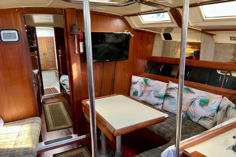 Slide: The Image of Interior of 1986 Hunter Legend 45 sailboat with cozy seating and wooden finishes. - 19