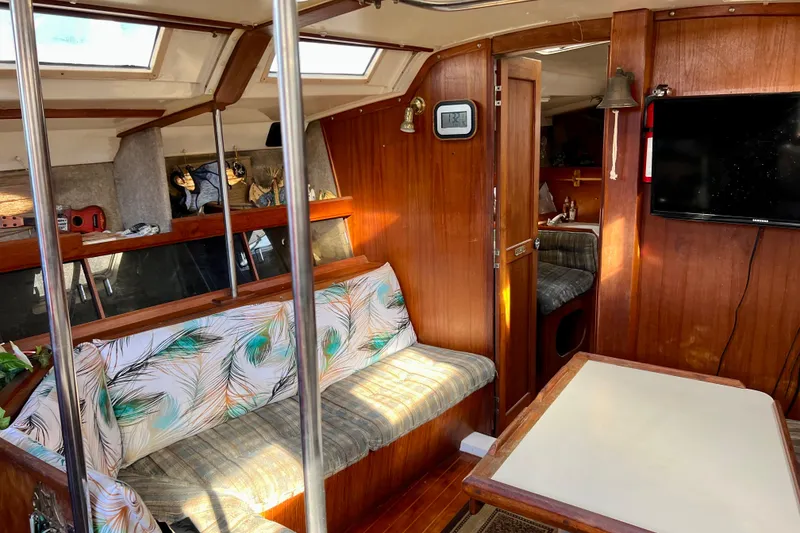Slide: The Image of Interior of 1986 Hunter Legend 45 sailboat with cozy seating and wooden finishes. - 22
