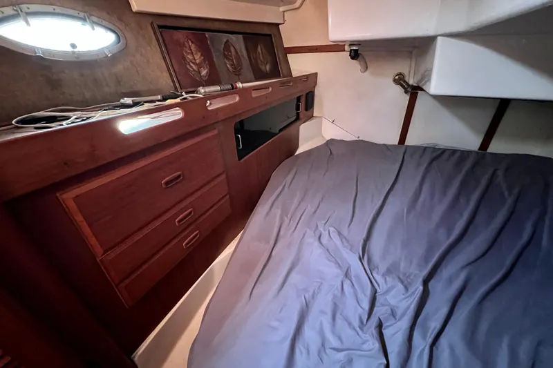 Slide: The Image of Cozy cabin interior of 1986 Hunter Legend 45 sailboat with wooden drawers and bed. - 32