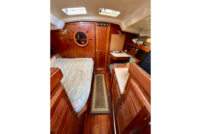 Slide: The Image of Interior of 1986 Hunter Legend 45 sailboat with wooden furnishings and cozy cabin. - 38