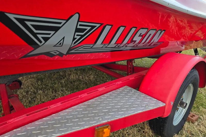 Slide: The Image of Red 1978 Allison Boats 20 trailer with logo, featuring diamond plate step. - 14