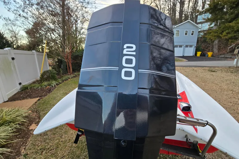 Slide: The Image of 1978 Allison Boats 20 with powerful 200 engine, parked in a residential yard. - 21