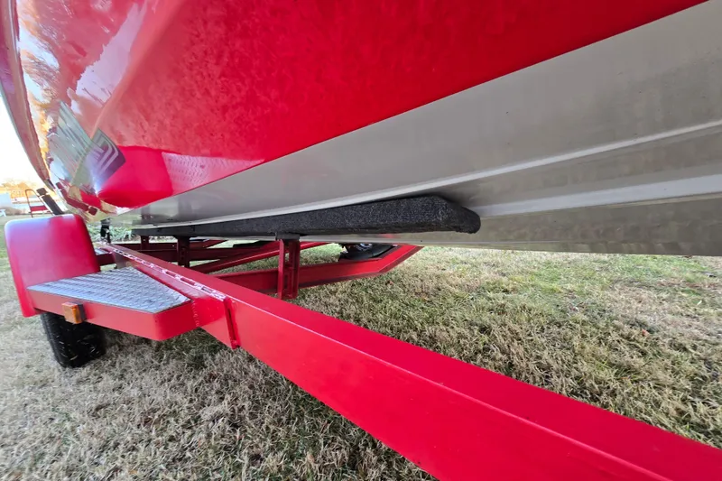 Slide: The Image of Red 1978 Allison Boats 20 on trailer, side view, parked on grass. - 27