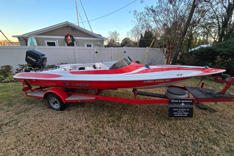 Slide: The Image of 1978 Allison Boats 20, red and white speedboat on trailer, parked in a yard. - 28