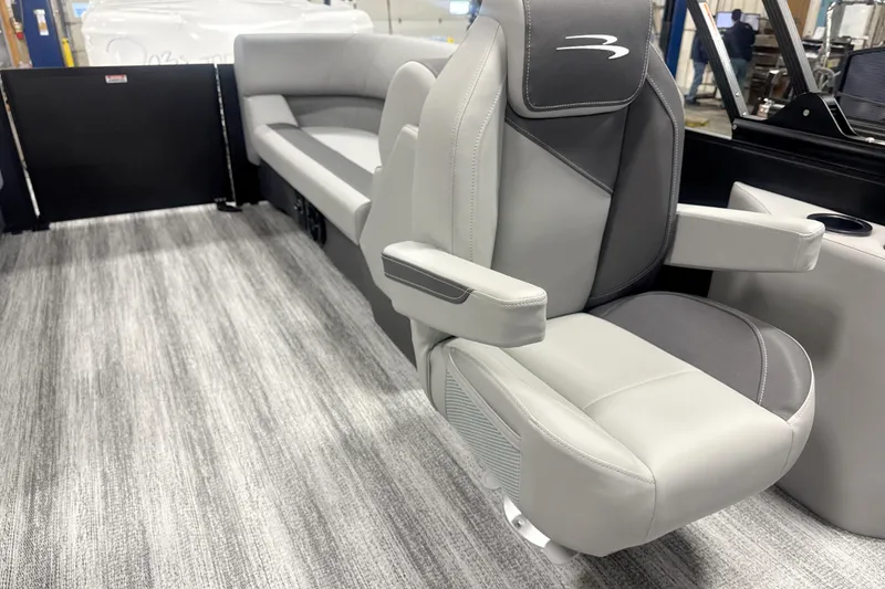 Slide: The Image of 2026 Bennington 22 S STERN RADIUS boat interior with gray seating and modern design. - 13