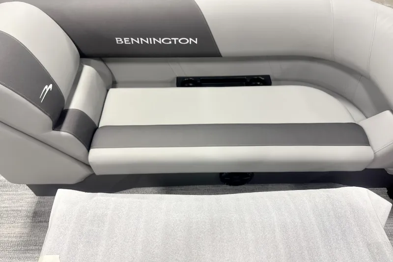 Slide: The Image of 2026 Bennington 22 S STERN RADIUS boat seating, featuring sleek gray and black upholstery. - 7
