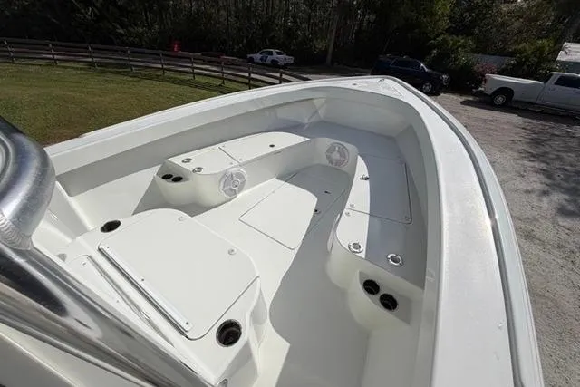 Slide: The Image of 2017 Stuart 27 boat deck with seating and storage compartments. - 11
