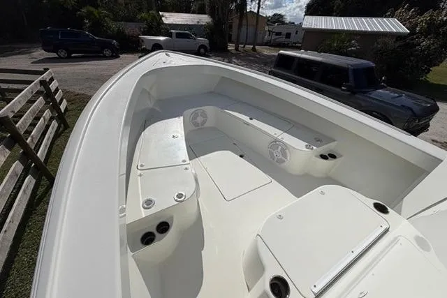 Slide: The Image of 2017 Stuart 27 boat interior with seating and storage compartments. - 15