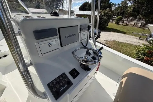 Slide: The Image of Control panel of a 2017 Stuart 27 boat with Garmin navigation system. - 19