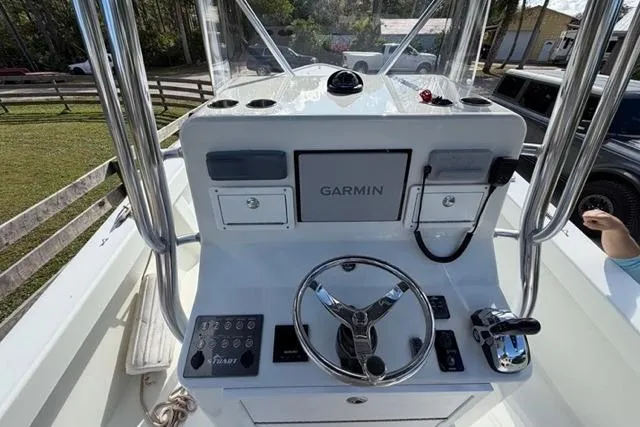 Slide: The Image of Center console of a 2017 Stuart 27 boat with Garmin navigation system. - 3