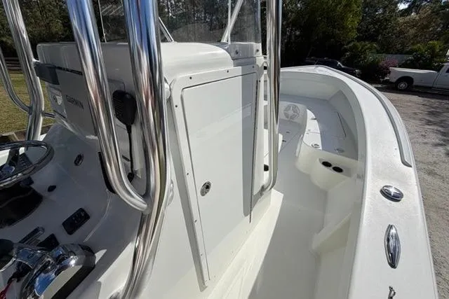 Slide: The Image of 2017 Stuart 27 boat with sleek white deck and chrome details. - 7