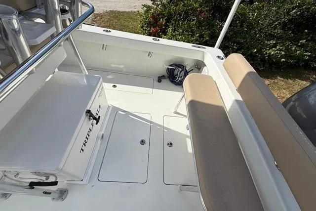Slide: The Image of 2017 Stuart 27 boat interior with seating and storage compartments. - 8