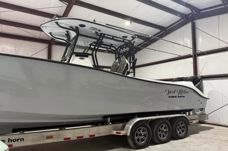 Slide: The Image of 2023 Cape Horn 34 XS boat on trailer in indoor storage facility. - 28
