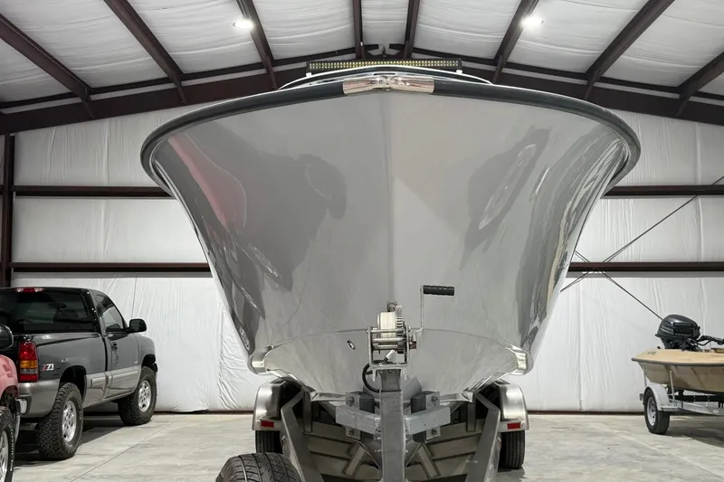 Slide: The Image of 2023 Cape Horn 34 XS boat on trailer in a garage. - 39