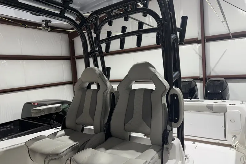Slide: The Image of 2023 Cape Horn 34 XS boat interior with dual seats and rod holders. - 40