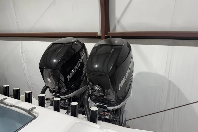 Slide: The Image of 2023 Cape Horn 34 XS with dual Mercury outboard engines in a storage facility. - 38