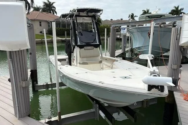 The Image of 2023 Key West 210 Bay Reef boat docked in a marina setting. - 0