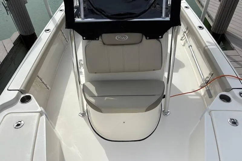 Slide: The Image of 2023 Key West 210 Bay Reef boat interior with seating and console. - 14