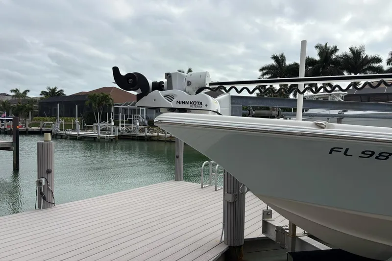 Slide: The Image of 2023 Key West 210 Bay Reef boat docked with Minn Kota trolling motor. - 22