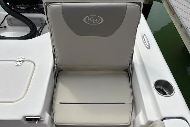 Slide: The Image of 2023 Key West 210 Bay Reef boat seat with cup holder and storage compartment. - 23