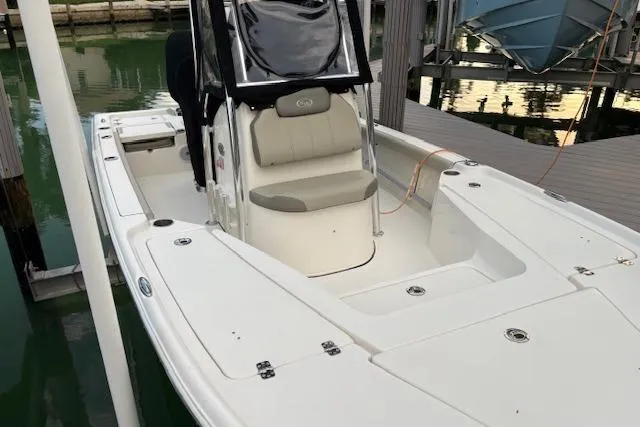 Slide: The Image of 2023 Key West 210 Bay Reef boat docked, featuring spacious seating and sleek design. - 24