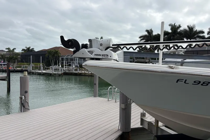 Slide: The Image of 2023 Key West 210 Bay Reef boat docked with Minn Kota trolling motor. - 6