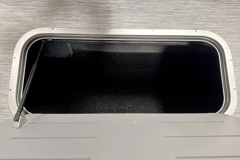 Slide: The Image of Open storage compartment in 2026 Bennington 22 S1 Stern Radius boat. - 13