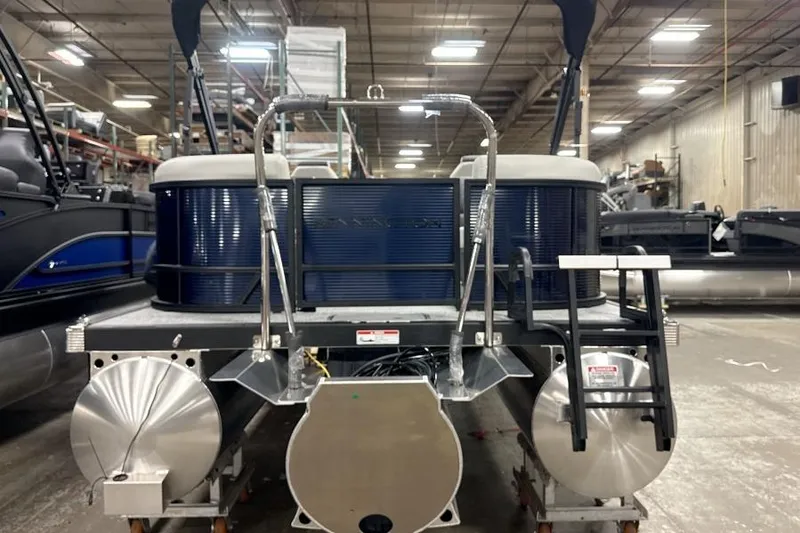 Slide: The Image of 2026 Bennington 22 S1 Stern Radius pontoon boat in a warehouse setting. - 4