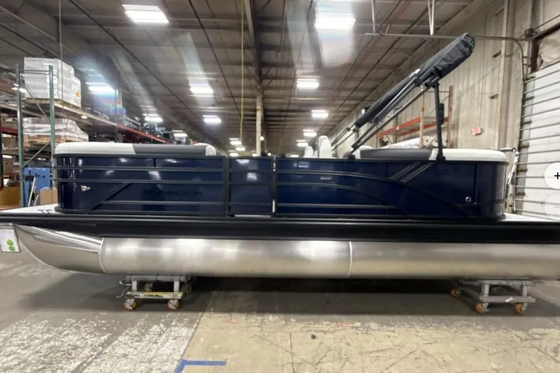 Slide: The Image of 2026 Bennington 22 S1 Stern Radius pontoon boat in warehouse setting. - 5
