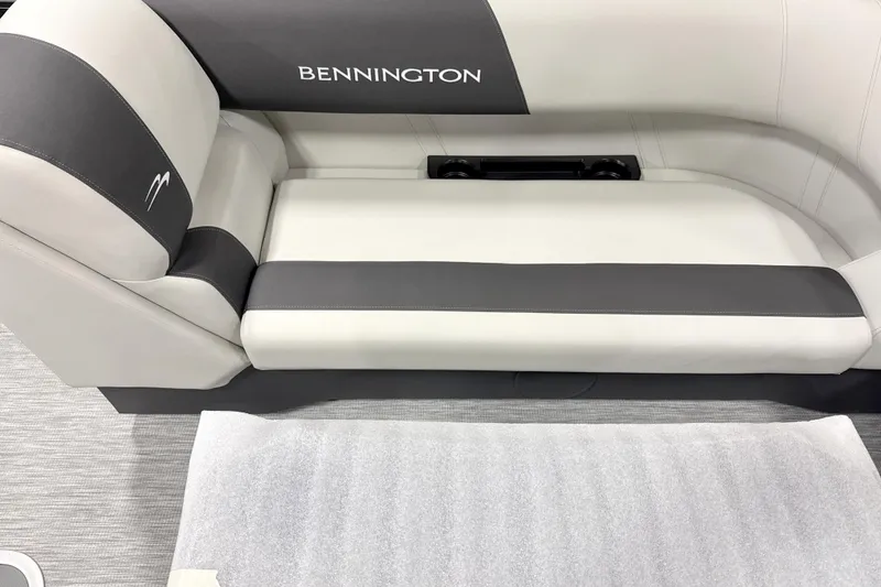 Slide: The Image of 2026 Bennington 22 S1 Stern Radius boat seating, featuring sleek gray and white upholstery. - 6