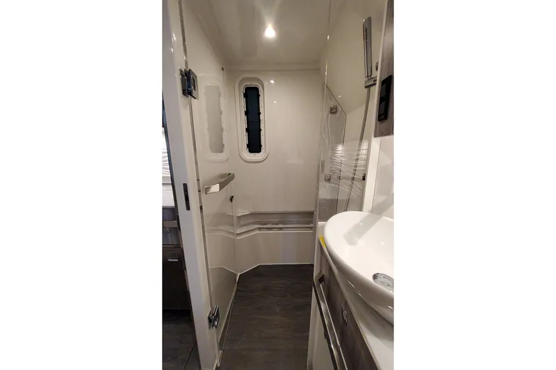 Slide: The Image of 2026 Formula 457 Center Console Fish interior bathroom with modern fixtures and sleek design. - 13