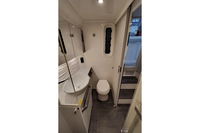 Slide: The Image of 2026 Formula 457 Center Console Fish boat bathroom with modern fixtures and sleek design. - 14
