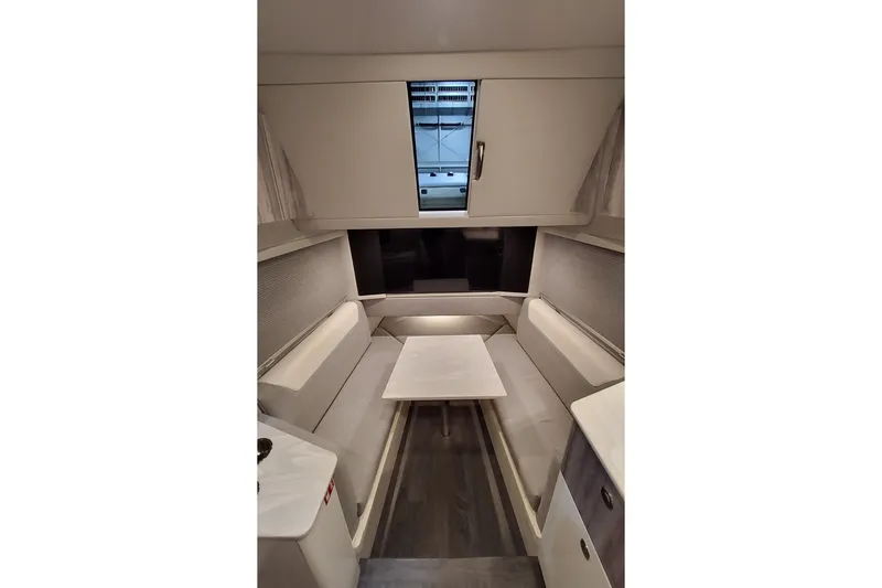 Slide: The Image of Interior of 2026 Formula 457 Center Console Fish, featuring a cozy seating area. - 16