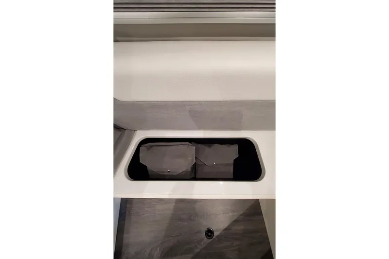 Slide: The Image of Storage compartment in 2026 Formula 457 Center Console Fish boat interior. - 19