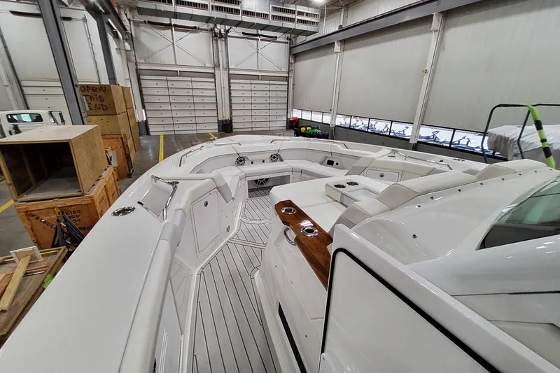 Slide: The Image of 2026 Formula 457 Center Console Fish boat interior in a spacious warehouse setting. - 20
