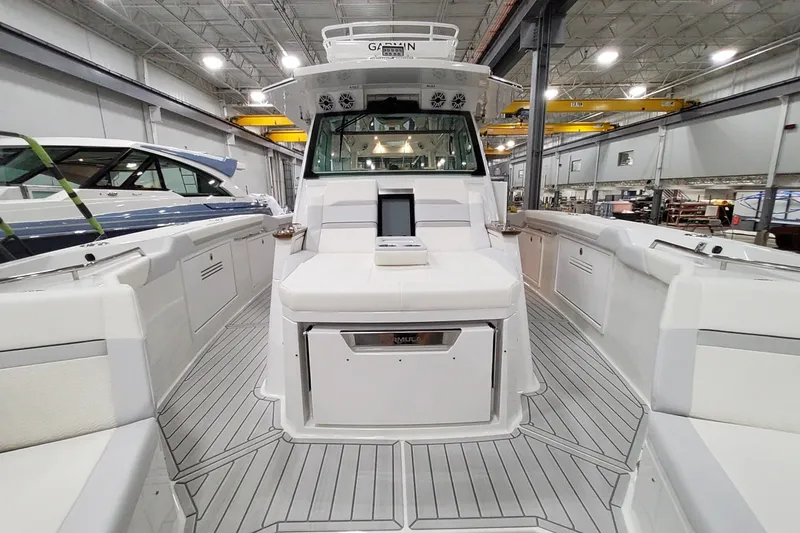Slide: The Image of 2026 Formula 457 Center Console Fish boat interior in a spacious showroom. - 21