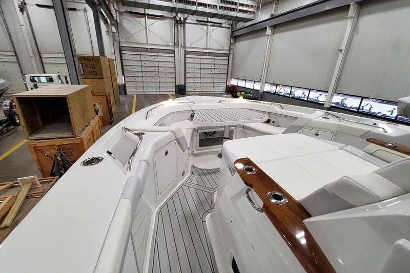 Slide: The Image of 2026 Formula 457 Center Console Fish boat interior in a warehouse setting. - 23