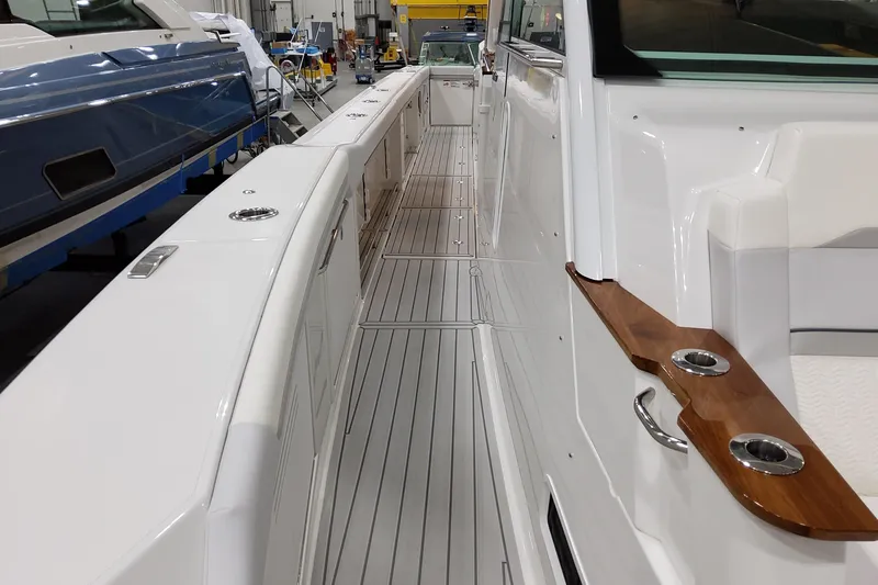 Slide: The Image of 2026 Formula 457 Center Console Fish boat interior with sleek design and wood accents. - 25