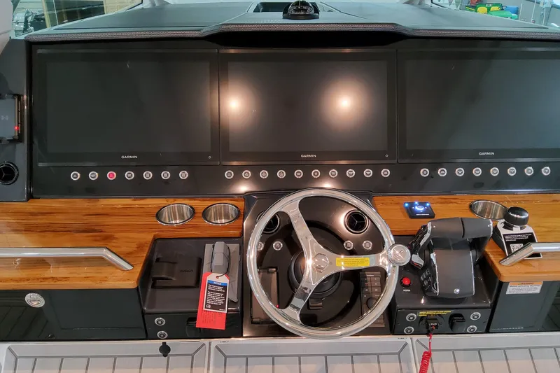 Slide: The Image of 2026 Formula 457 Center Console Fish dashboard with advanced navigation screens and controls. - 27
