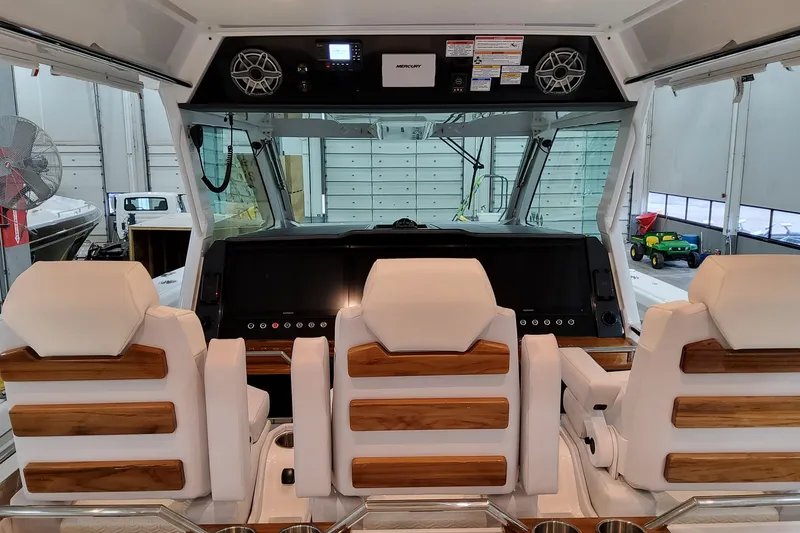 Slide: The Image of 2026 Formula 457 Center Console Fish boat interior with modern helm and seating. - 28