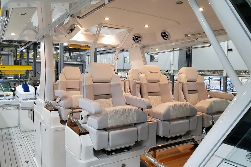 Slide: The Image of 2026 Formula 457 Center Console Fish boat interior with luxurious seating and modern design. - 29