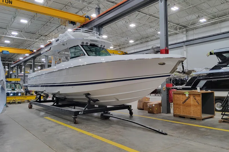 Slide: The Image of 2026 Formula 457 Center Console Fish boat in a manufacturing facility. - 3