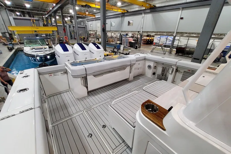 Slide: The Image of 2026 Formula 457 Center Console Fish boat interior in a manufacturing facility. - 32
