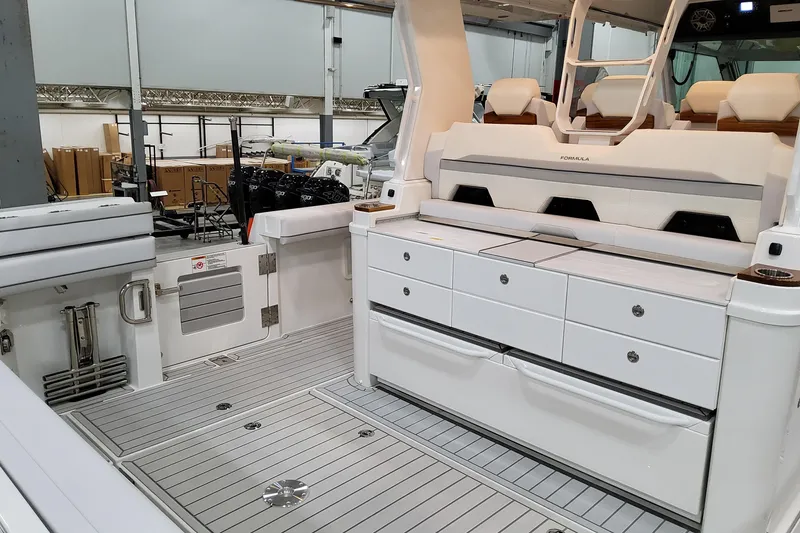 Slide: The Image of 2026 Formula 457 Center Console Fish boat interior with seating and storage compartments. - 33